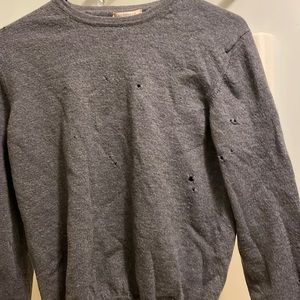 Gray Burberry sweater with many holes